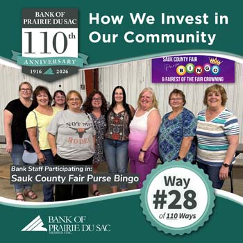 Way #28 - Nine smiling bank staff participating in Sauk County Fair purse bingo event.