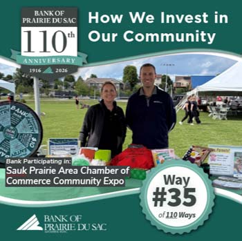 Way #35 - Bank staff standing behind bank's table at Chamber's Community Expo.