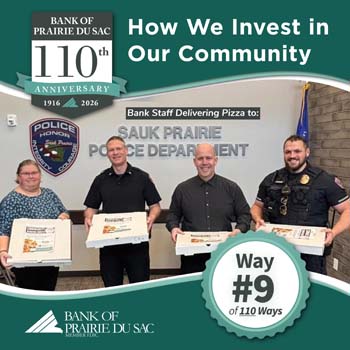 Bank of Prairie du Sas staff, Dawn & Tom, present Sauk Prairie Police Department with pizza for squad meeting meal.